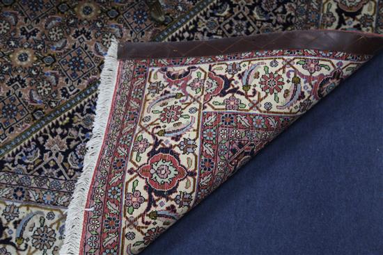 A modern Persian rug, 8ft by 5ft 7in.